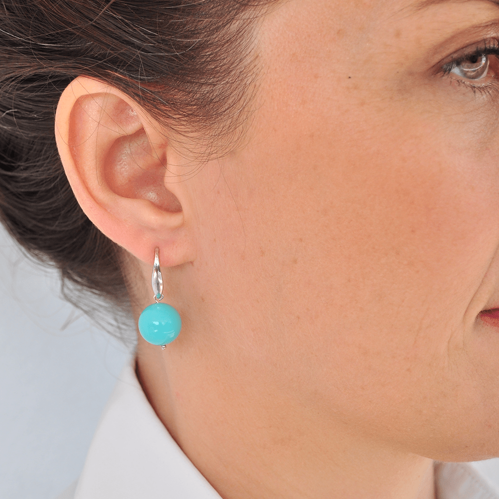 Handmade earrings with turquoise paste marbles 12mm tied with silver on an open hook made of silver 925°.