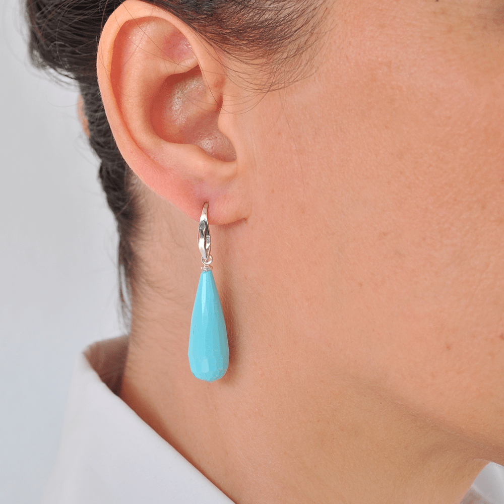 Handmade teardrop earrings made of turquoise paste tied with silver on an open hook made of silver 925°.